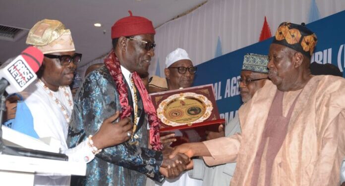 Ganduje receiving award
