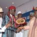 Ganduje receiving award